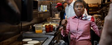 Winsome Earle-Sears, the Republican lieutenant governor of Virginia who is running for the top job, flips pancakes at Shorty's Diner in Richmond with a little help from her boss,Gov. Glenn Youngkin, on Monday. Voters will elect their first female governor on Tuesday. Photo by Ben Ackman