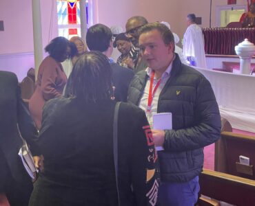 AU grad student George Smith interviewing church goers in Virginia before the 2025 election.