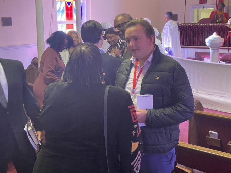 AU grad student George Smith interviewing church goers in Virginia before the 2025 election.