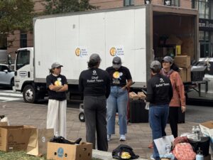 World Central Kitchen volunteers are loading after serving meals. (Joshua Sun)