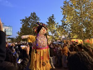 Participants carry a float during the Dia de los Muertos Celebration at The Wharf (Kordell Martin)