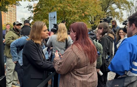 Eagle Editor-in-Chief Walker Whalen interviews a voter and a Spanberger rally on Monday. Photo by Robert Barnes