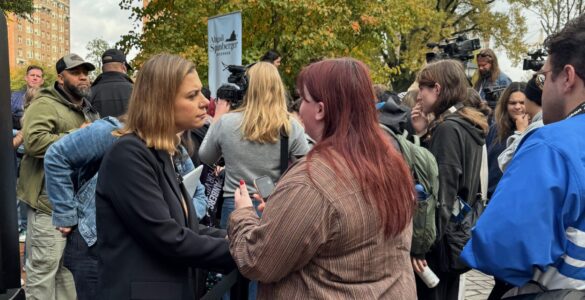 Eagle Editor-in-Chief Walker Whalen interviews a voter and a Spanberger rally on Monday. Photo by Robert Barnes