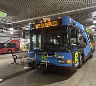 A Montgomery County Ride On bus sits at the bus station near Bethesda Metro Station Nov. 6, 2025. (Kendall Staton) 