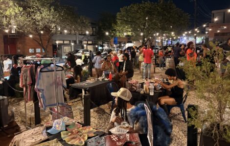 A group of people gather in the Anacostia business corridor for the Art All Night Anacostia festival.