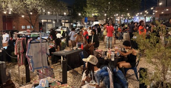 A group of people gather in the Anacostia business corridor for the Art All Night Anacostia festival.