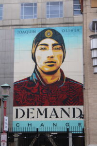 The mural, "Demand Change," on a building in Chinatown. Photo by Birchard Allen.