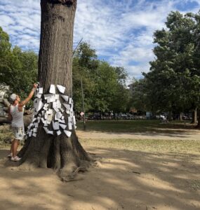 Northern Virginia resident pins message to stump in Dupont Circle Park.