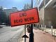 An orange warning sign that says "End Road Work" at the end of construction on Georgia Avenue in Silver Spring.