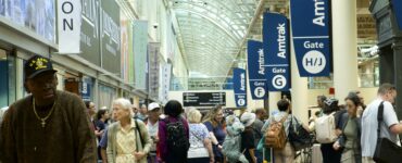 Image of crowd of people waiting for trains at Union Station.