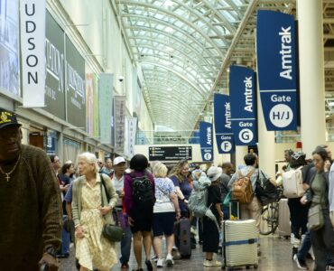 Image of crowd of people waiting for trains at Union Station.