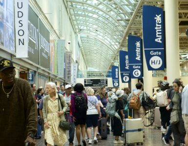 Image of crowd of people waiting for trains at Union Station.