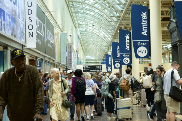 Image of crowd of people waiting for trains at Union Station.