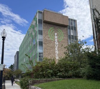 The Frequency building with logo painted on side