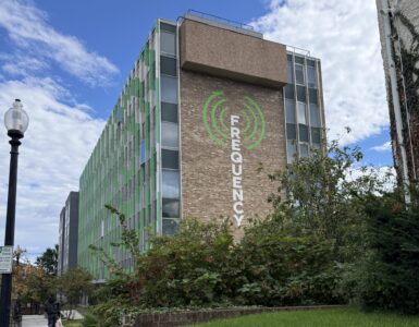 The Frequency building with logo painted on side
