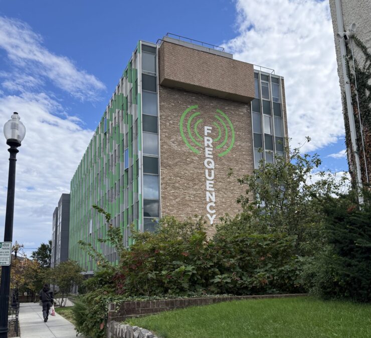The Frequency building with logo painted on side